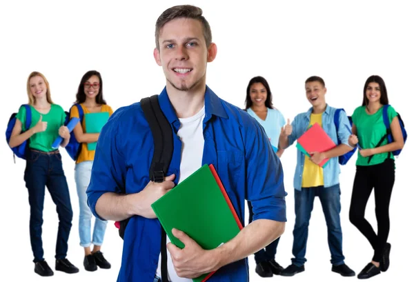 German male student with paperwork and group of students Royalty Free Stock Photos