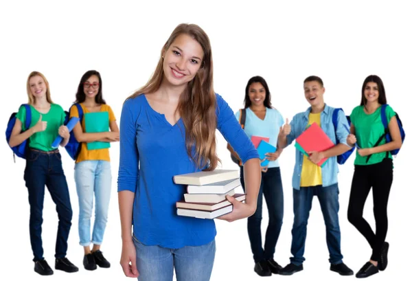 Linda estudiante alemana con libros y grupo de estudiantes —  Fotos de Stock