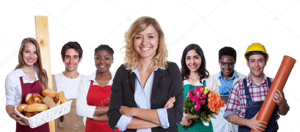 Young female business trainee with group of other international 