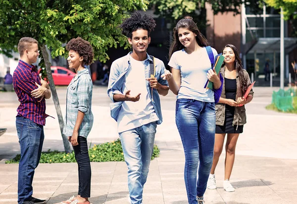 Group of talking students in city — Stock Photo, Image