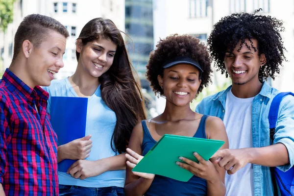 Group of multi ethnic students talking about studies — Stock Photo, Image