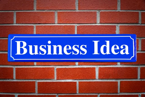 Επιχειρηματική ιδέα πινακίδα στο τοίχο τούβλο — Φωτογραφία Αρχείου