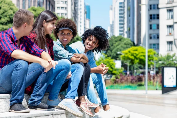 Group of latin american and afican hipster young adults in discu — Stock Photo, Image