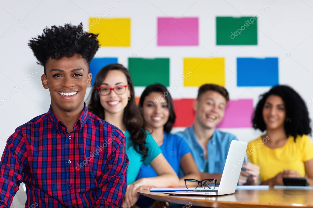 African american male student with group of international studen