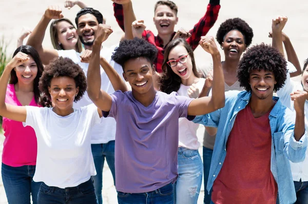 Group of successful cheering african american and caucasian and — Stock Photo, Image