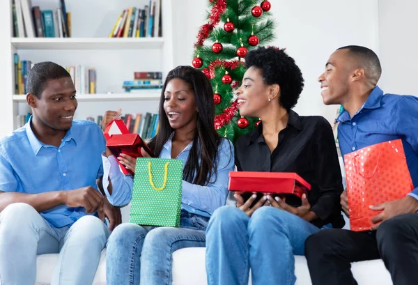 Happy african african family celebrating christmas with gifts an — Stock Photo, Image