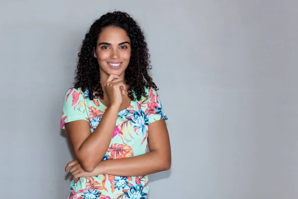 Laughing latin american woman with copy space