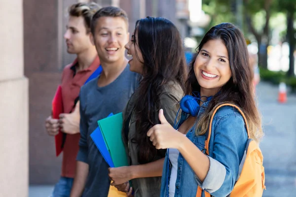 Successful american female student with group of friends — Stock Photo, Image