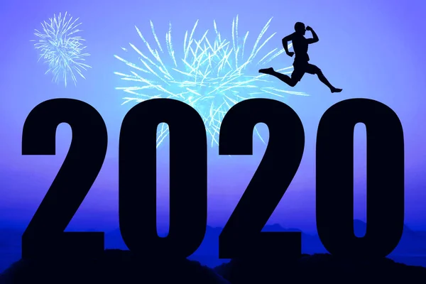 Blue night with fireworks and new year 2020 and sporty running m — Stock Photo, Image