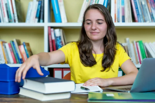 Young German Female Student Learning Book Computer Desk Indoors Home — Stock Photo, Image