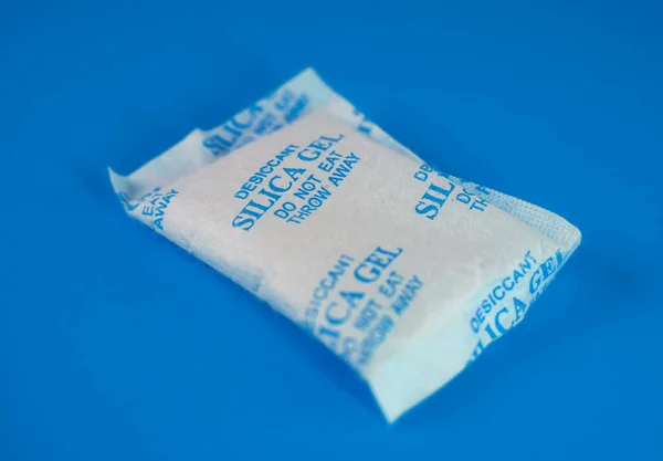 Desiccant or silica gel in white paper packaging. Silica Gel
