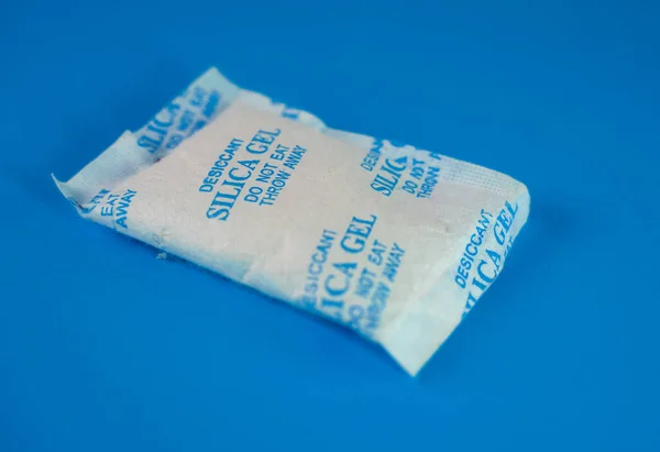 Desiccant or silica gel in white paper packaging. Silica Gel