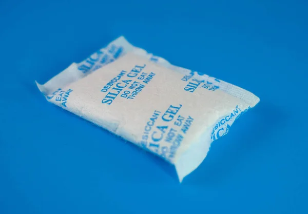 Desiccant or silica gel in white paper packaging. Silica Gel