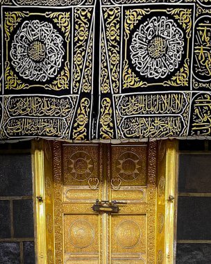 MECCA, SAUDI ARABIA - MARCH 29, 2019 The door of the Kaaba called Multazam at Grant holy mosque Al-Haram in Mecca Saudi Arabia. Muslim Pilgrims at The Kaaba in The Great Mosque of Mecca.