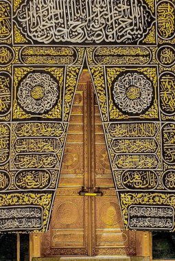 MECCA, SAUDI ARABIA - MARCH 29, 2019 The door of the Kaaba called Multazam at Grant holy mosque Al-Haram in Mecca Saudi Arabia. Muslim Pilgrims at The Kaaba in The Great Mosque of Mecca.