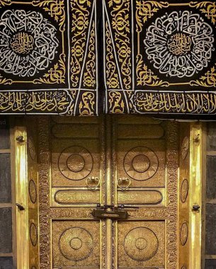 MECCA, SAUDI ARABIA - MARCH 29, 2019 The door of the Kaaba called Multazam at Grant holy mosque Al-Haram in Mecca Saudi Arabia. Muslim Pilgrims at The Kaaba in The Great Mosque of Mecca.