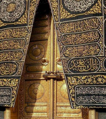 MECCA, SAUDI ARABIA - MARCH 29, 2019 The door of the Kaaba called Multazam at Grant holy mosque Al-Haram in Mecca Saudi Arabia. Muslim Pilgrims at The Kaaba in The Great Mosque of Mecca.