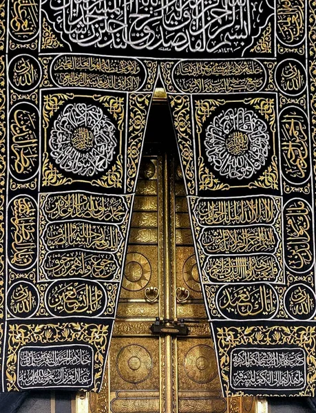 MECCA, SAUDI ARABIA - MARCH 29, 2019 The door of the Kaaba called Multazam at Grant holy mosque Al-Haram in Mecca Saudi Arabia. Muslim Pilgrims at The Kaaba in The Great Mosque of Mecca.