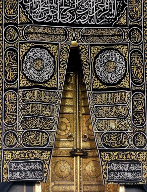 MECCA, SAUDI ARABIA - MARCH 29, 2019 The door of the Kaaba called Multazam at Grant holy mosque Al-Haram in Mecca Saudi Arabia. Muslim Pilgrims at The Kaaba in The Great Mosque of Mecca.