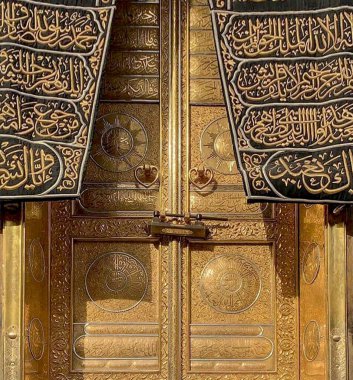 MECCA, SAUDI ARABIA - MARCH 29, 2019 The door of the Kaaba called Multazam at Grant holy mosque Al-Haram in Mecca Saudi Arabia. Muslim Pilgrims at The Kaaba in The Great Mosque of Mecca.