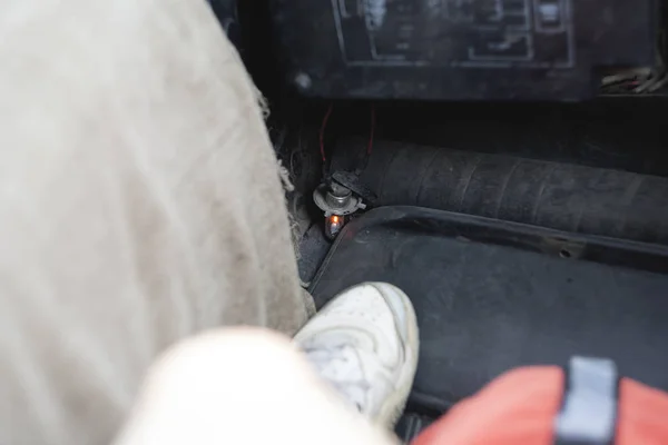 light indicator at the passenger's feet. car in need of repair