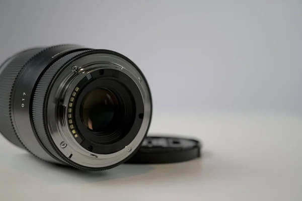 Dslr camera lense, close-up view on table with smooth background — Stock Photo, Image