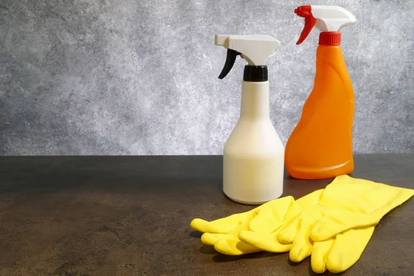 Set of cleaning supplies on grey background