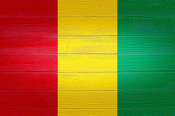 Bandera de Guinea pintada sobre fondo de madera vieja. Textura de tabla de madera cepillada. Textura de madera Bandera de fondo de Guinea . — Foto de Stock