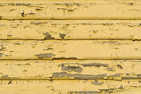 La textura de los antiguos tablones de madera amarilla rayada. Textura de pared de madera pintada antigua . — Foto de Stock