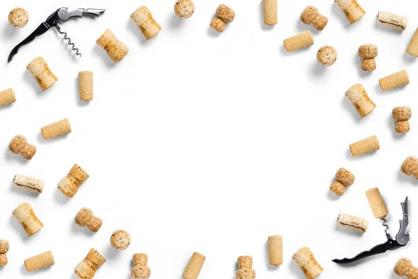 wine corks creative flat lay layout on a white backlit background. flatlay creative wine set with corks and corkscrew for design concept