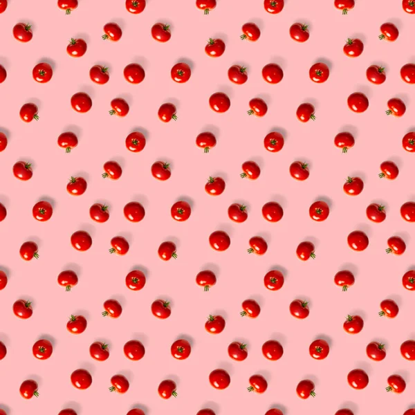 Seamless pattern with red ripe tomatoes. Tomato isolated on red background. Vegetable abstract seamless pattern. Organic Tomatoes flat lay.