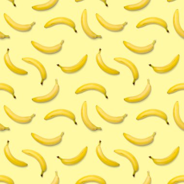 Muz pürüzsüz desen. Patlamış sanat muzu deseni. Muzlu tropik soyut arka plan. Sarı arka planda sarı muz renkli meyve deseni, düz yatıyordu.