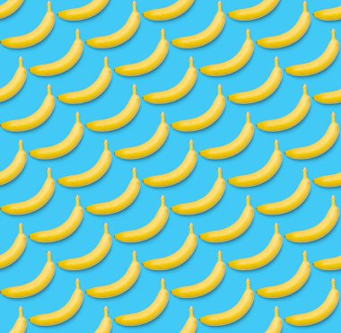 Muz pürüzsüz desen. Patlamış sanat muzu deseni. Muzlu tropik soyut arka plan. Mavi arka planda sarı muz renkli meyve deseni, düz yatıyordu.