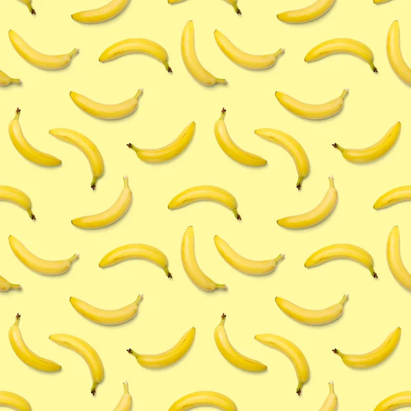 Bananas seamless pattern. pop art bananas pattern. Tropical abstract background with banana. Colorful fruit pattern of yellow banana on yellow background, flat lay