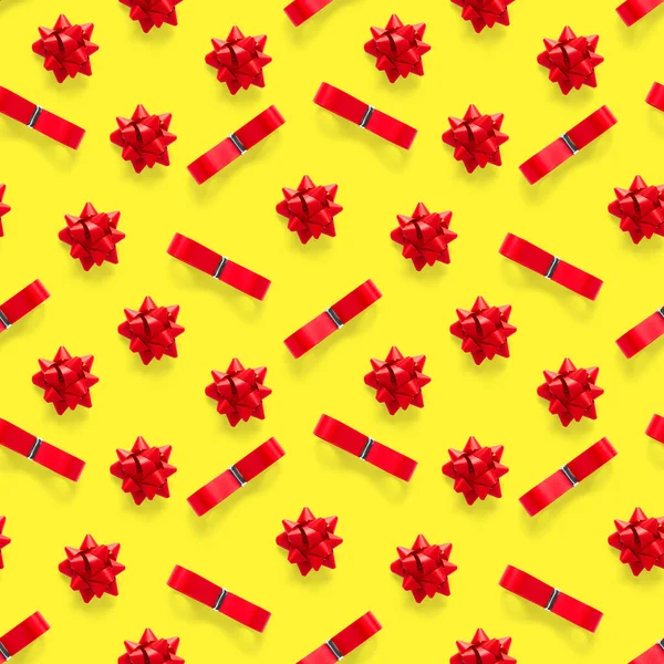 Seamless regular creative Christmas pattern with New Year decorations on yellow background. xmas Modern Seamless pattern made from christmas decorations. Photo quality pattern for fabric, prints, wallpapers, banners or creative design works.