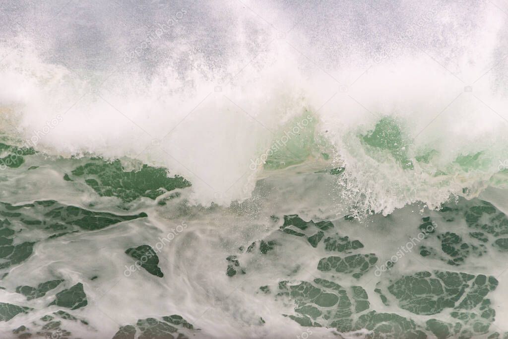 white foam of a wave at leblon beach in Rio de Janeiro Brazil.