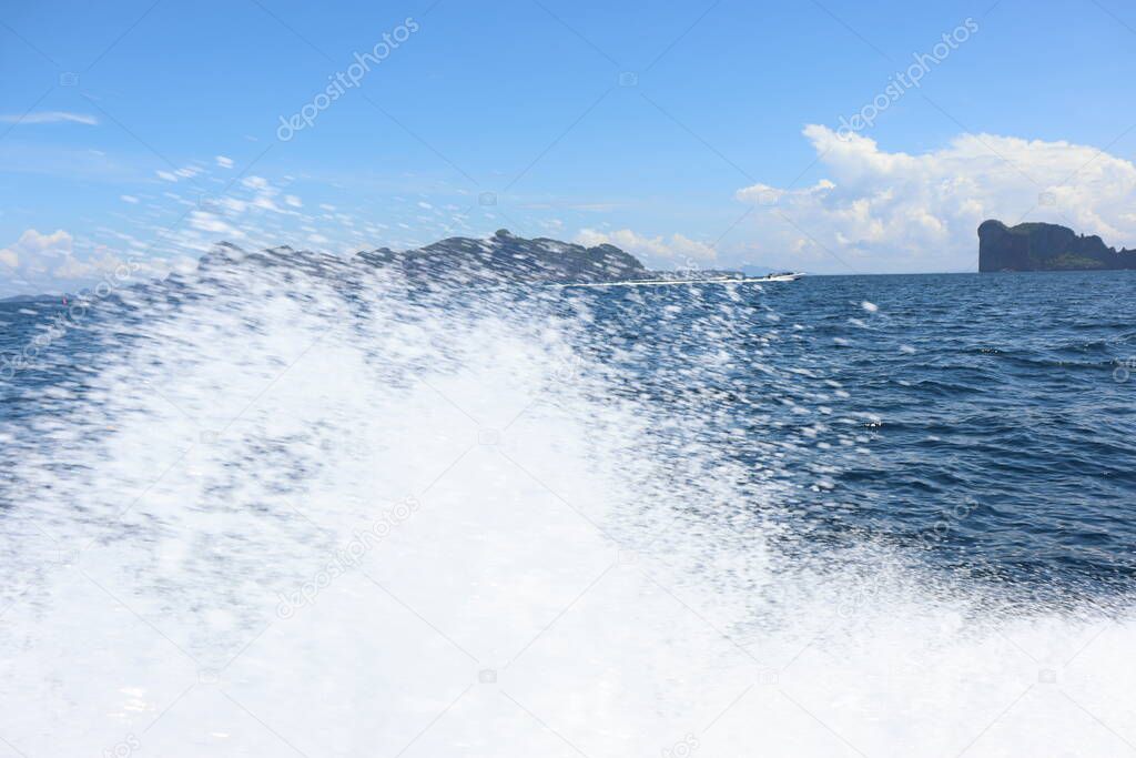 background waves and splashes, speedboat ride near tropical islands in ocean in asia