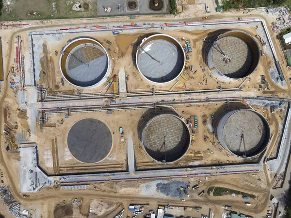 Construction of chemical storage tank with oil refinery background, Oil refinery plant at day. Aerial view from drone top view