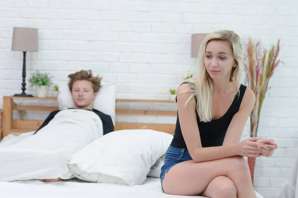 Frustrated sad girlfriend sit on bed think of relationship prob