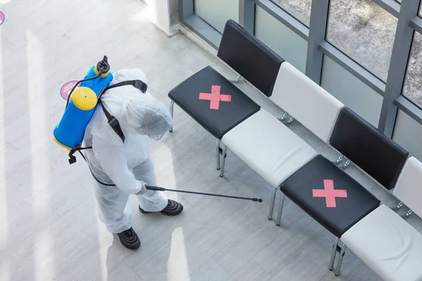 Cleaning and Disinfection at office amid the coronavirus epidemic Professional teams for disinfection efforts Infection prevention and control of epidemic Protective suit and mask.