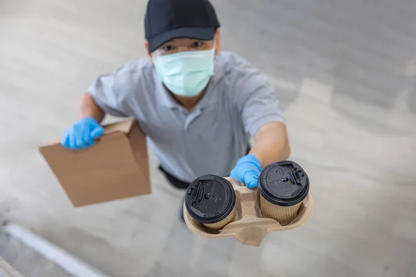 Coffee Delivery Man Medical Rubber Gloves Mask Holding Two Cups — Stock Photo, Image