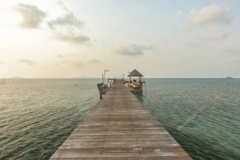  Long wooden bridge go to pavilion on the sea in beautiful tropical island, Thailand.
