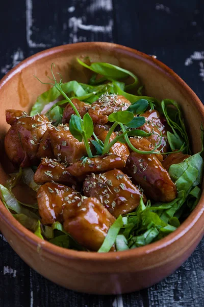 small tasty fresh chicken bites in a rustic bowl