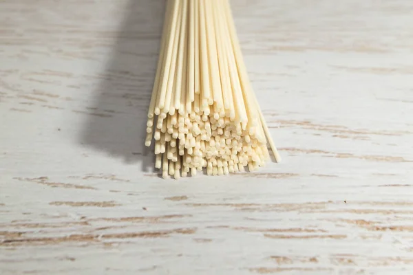 Thin noodle noodles on the floor background