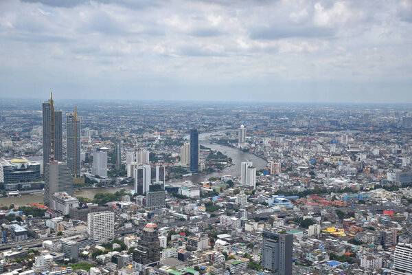 Bangkok, Thailand, 08.20.2019: Panoramic skyline view of Bangkok from above from The Peak 314 meters high of the King Power MahaNakhon 78 floors skyscraper, Thailands highest outdoor observation area