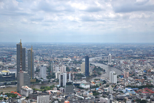 Bangkok, Thailand, 08.20.2019: Panoramic skyline view of Bangkok from above from The Peak 314 meters high of the King Power MahaNakhon 78 floors skyscraper, Thailands highest outdoor observation area