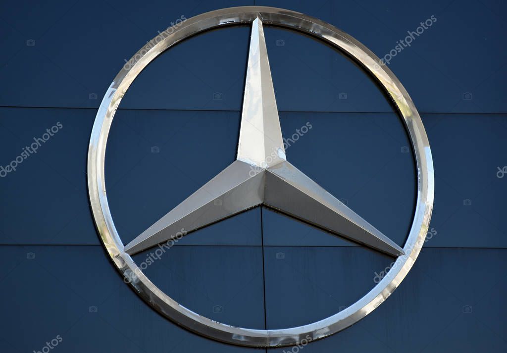 Milano, Italy, 08.04.2019: Mercedes-Benz three-pointed star logo on top of Headquarter building complex of Merbag - Official Mercedes-Benz Dealership in Uptown Milan, the first Smart District of Milan
