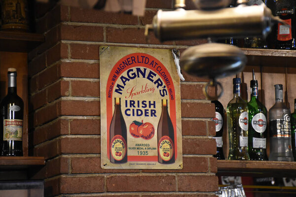 Milan, Italy, 08.04.2019: Interior of O'Connell Irish Pub with a long beer tap in the Brera Art District which is an artists' neighborhood and a place of bohemian atmosphere