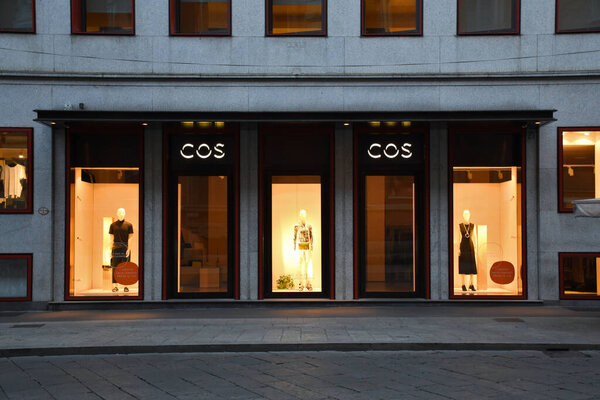 Milan, Italy, 08.04.2019: Storefront, entrancevand facade of COS Store (fashion brand for women, men who want modern, functional, considered design) in De Agostini Building in Brera Art District.