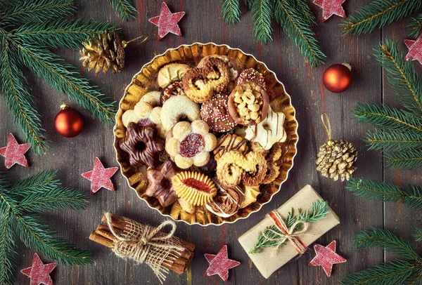 Plate of Christmas cookies on dark rustic background — Stock Photo, Image